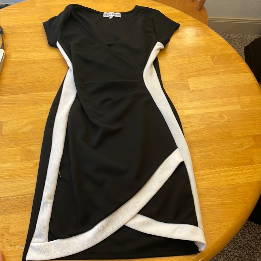 Medium. Almost famous brand. Black and white dress. Never worn.